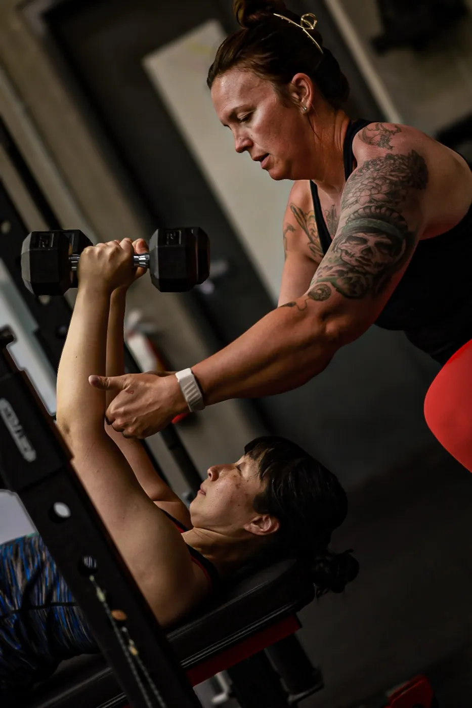 Evolve Kickbox coach guiding a member through strength training in Las Vegas