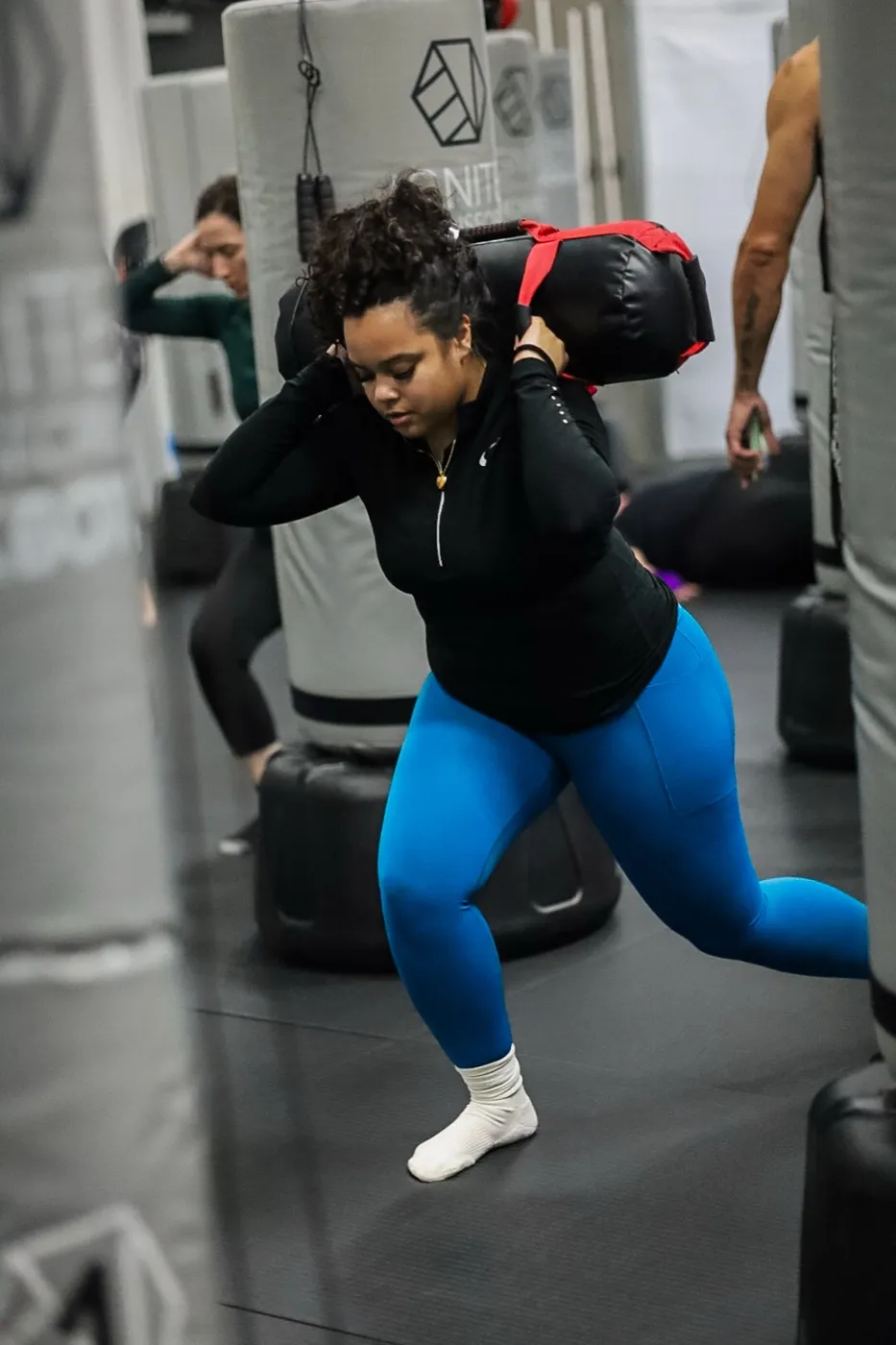 Strength conditioning with a sandbag at Evolve Kickbox in Las Vegas