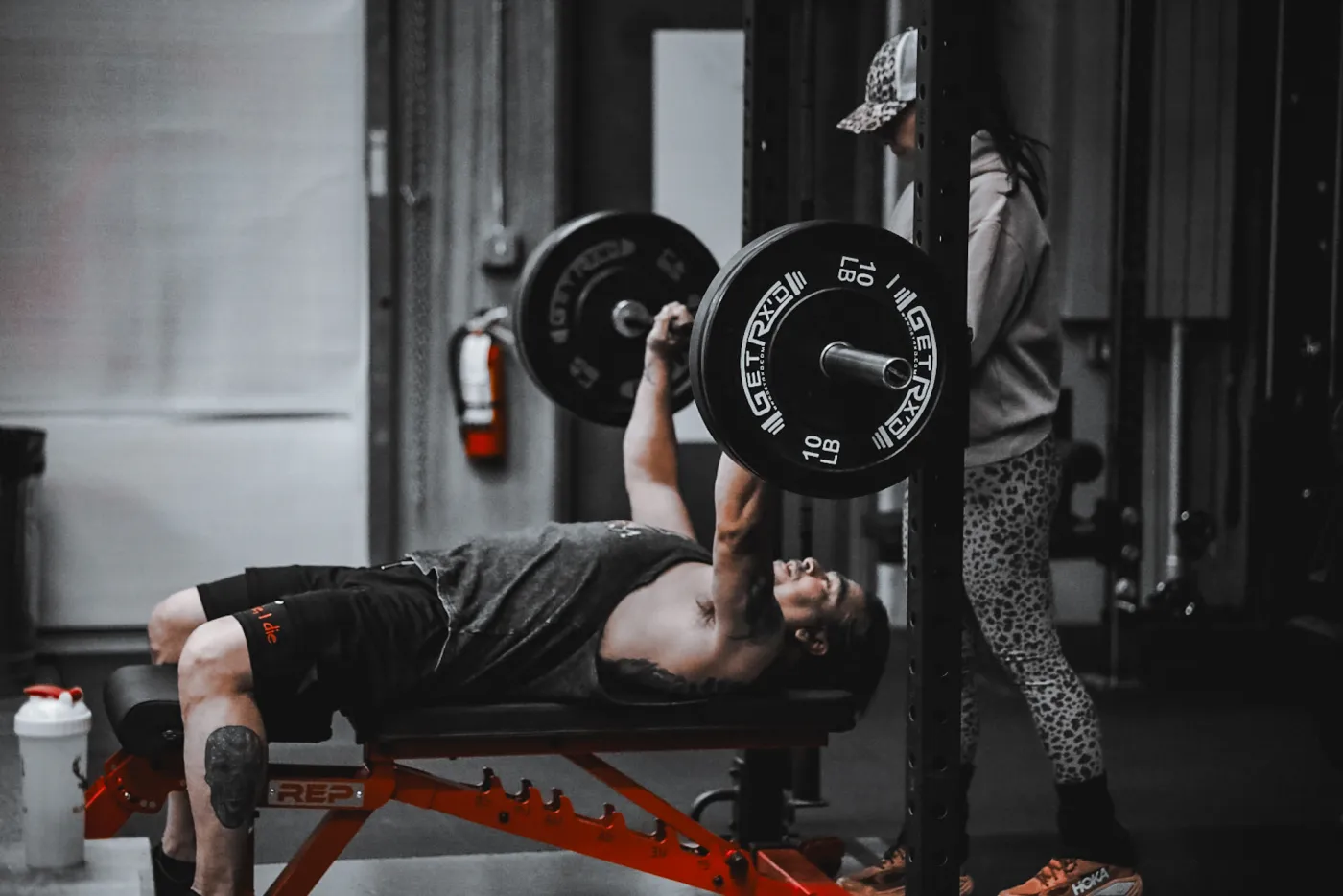 Strength training at Evolve Kickbox — a member on the bench press in Las Vegas